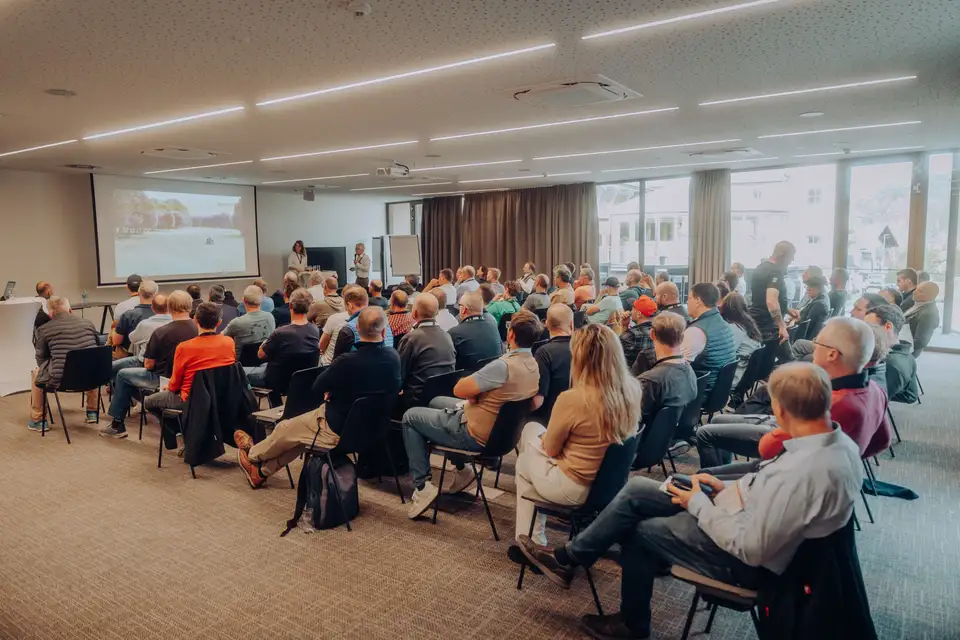 Audience at a presentation in a conference room